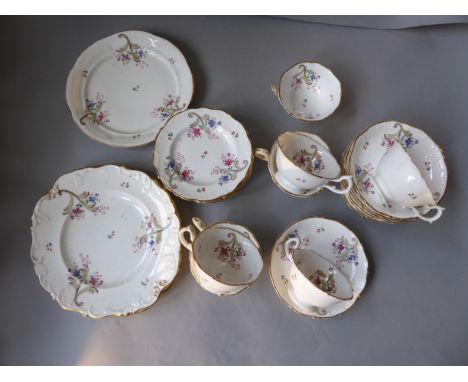 A Victorian part tea service with floral decoration and gold numbered base 6 cups and saucers, three large plates, four side 
