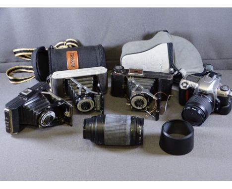 NIKON FC5 CAMERA with a Nikon AF Nikkor zoom lense and three period cameras