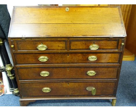 GEORGIAN OAK &amp; CROSSBANDED MAHOGANY FALL FRONT BUREAU, central cupboard interior with drawer and pigeon hole arrangement,
