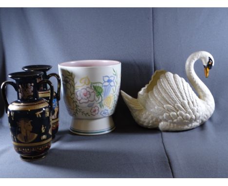 DARTMOUTH SWAN PORCELAIN CENTREPIECE, Poole style planter and a pair of pharaoh themed vases