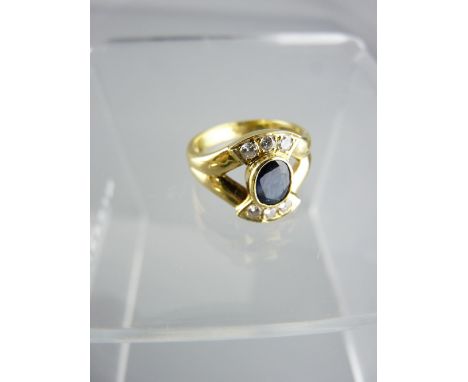 18CT GOLD DIAMOND &amp; SAPPHIRE RING, SIZE N, 5.8grms the central oval sapphire and six diamonds set in the form of a bow