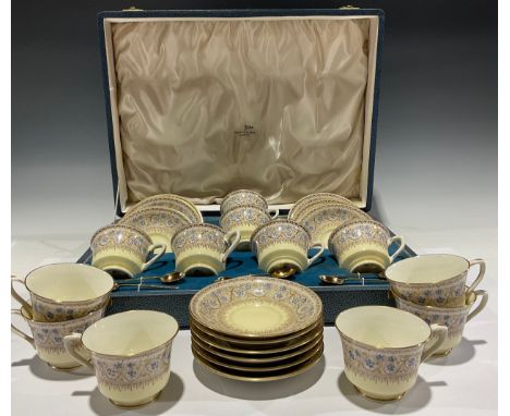 A set of six Royal Worcester Lady Evelyn pattern tea cups and saucers, the fitted case with six Art Deco silver gilt spoons, 