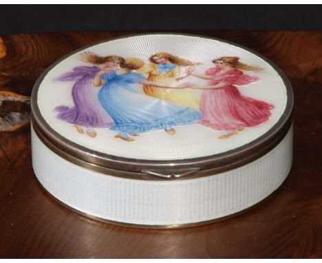 An early 20th century Continental silver and enamel circular table snuff box, hinged cover decorated in polychrome with young