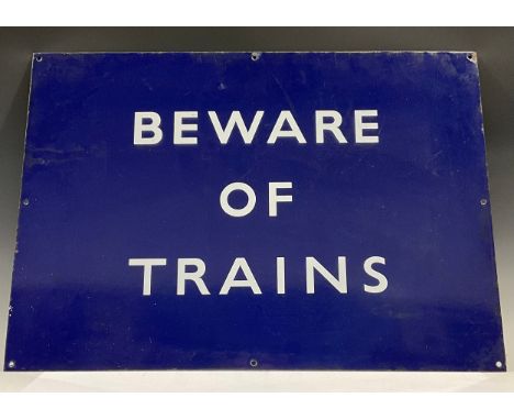 A rectangular blue enamel railway sign, Beware of Trains, mid 20th century, 48.5cm x 68.5cm 