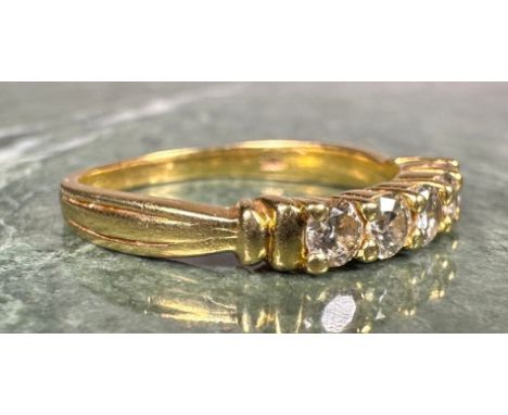A diamond ring, linear set with five round brilliant cut diamonds, total estimated diamond weight approx 0.75ct, yellow metal
