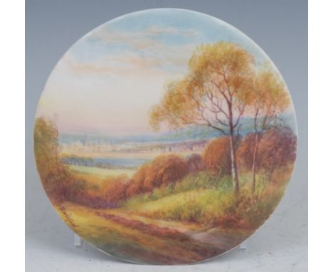 A Royal Worcester circular plaque, painted by R. Rushton, signed, with a view of Oxford from Boars Hill, titled, 11.5cm diame
