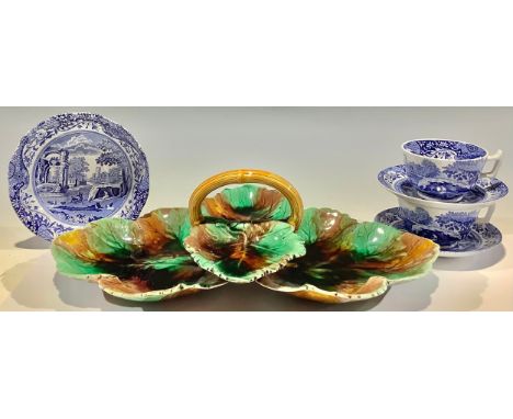 A 19th century Wedgwood majolica strawberries and cream stand, the leaf shaped dishes glazed in mottled green and brown with 