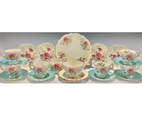 An Aynsley tea service for six, printed with poppies and other flowers, comprising cake plate, side plates, cream jug, sugar 