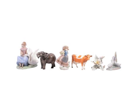 A collection of Lladro, Nao, Beswick and Leonardo collection figurines, to include Lladro large swan 5230; large swan with wi