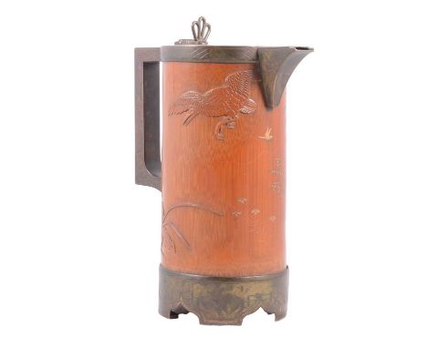 19th century Chinese carved bamboo and silver-plated jug, the metal mounts engraved with linear and geometric designs, the ba