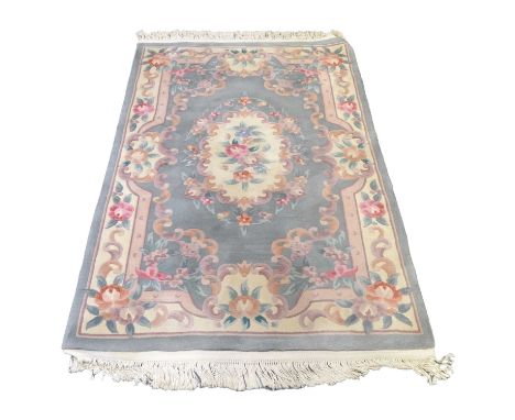 A Chinese 'Jade' rug with sage green ground, 185cm x 121cm, and a similar Kayam rug, cream ground, 155cm x 92cm.Qty: 2