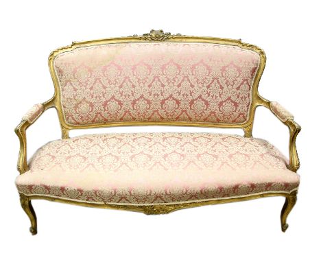 Early 20th century gilt wood and gesso salon suite comprising sofa, pair of arm chairs, and two single chairs .   