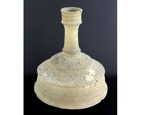 13th century Seljuk unglazed pottery candlestick, incised and decorated with bands of studs and geometric design, 33cm high,E