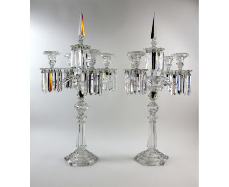 Pair of four light glass candelabra with prism drops 79cm high.   Parts with damage and replacements