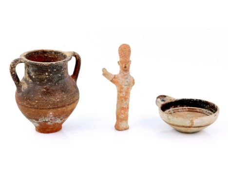 A small Cypriot Iron Age black on red ware amphora, the body decorated with concentric circle motifs  and encircling bands, 1