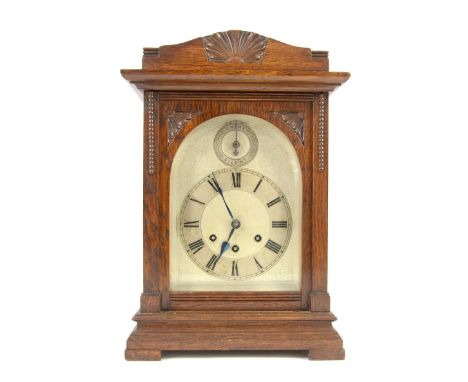 Oak cased mantle clock the German three train movement striking on a gong, 42cm x 28cm x 19cm.   