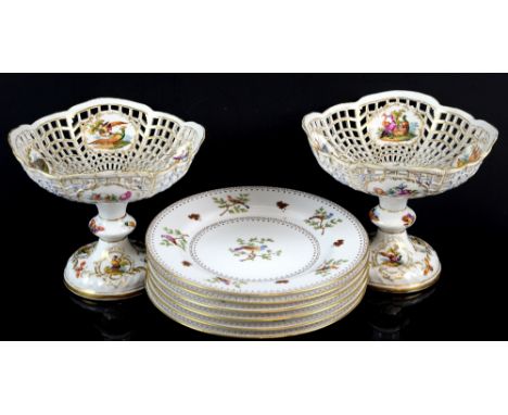 Pair of 19th century Berlin Comports with pierced bowls painted with panels of birds and flowers within gilded borders. 16cm,