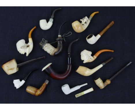 Large collection of smoking pipes, mainly European, including late 19th century carved meerschaum pipe in form of an African 