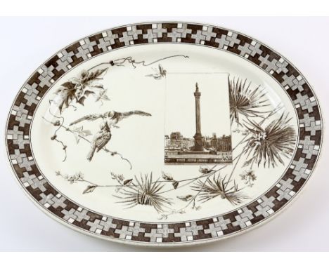 An unusual  transfer print meat plate by Powell Bishop and Stonier, part of the London scenes series, with decoration of bird