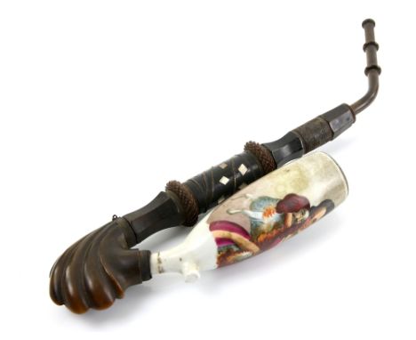 19th century porcelain and carved horn smoker's pipe, the porcelain bowl painted with a lady holding a King Charles' spaniel,