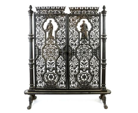 Victorian cast iron firescreen on column end supports, hinged with two doors, each decorated with a classical figure surround
