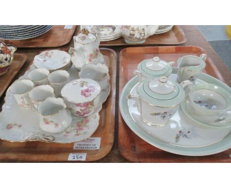 Two Limoges French porcelain teasets on trays; one marked 'Limoges, France, Charles Ahrenfeldt' with daisy pattern; teapot, l