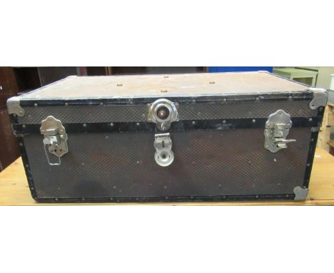 Vintage canvas and metal banded travelling trunk.(B.P. 21% + VAT) 