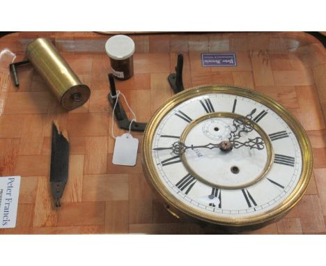 Clock face with Roman numerals and various clock parts including weight.(B.P. 21% + VAT) 