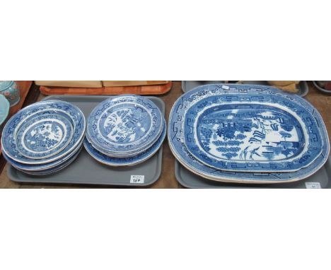 Two trays comprising 19th Century blue and white 'Willow' transfer printed oval meat dishes and similar plates. (B.P. 21% + V