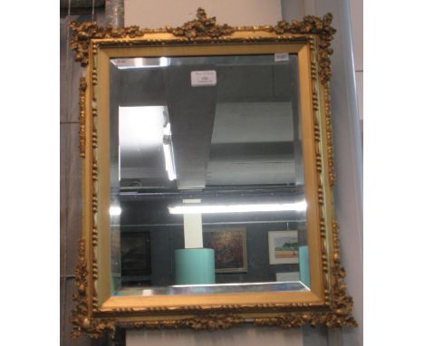 Good quality ornately carved bevel plate gilt framed mirror with moulded leaf and acorn decoration. (B.P. 21% + VAT) Dimensio