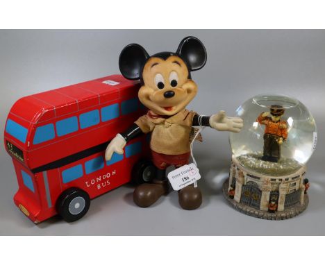 Vintage plastic figure of Walt Disney's Mickey Mouse with movable arms, together with a wooden London bus model and 'The Leon