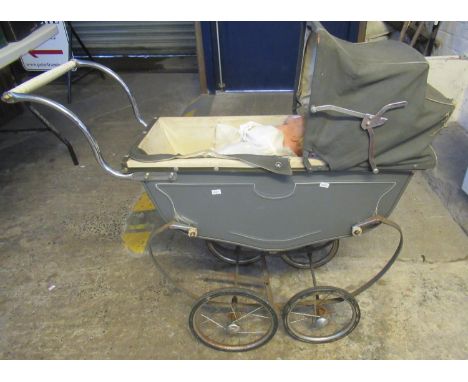 H. Schutte vintage unicycle, together with a vintage toy pram and dolls.(B.P. 21% + VAT) 