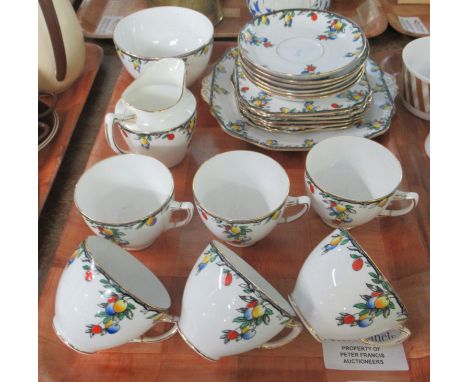 Wetley china English teaware with fruit design to include; teacups and saucers, various plates, milk jug and sucrier. (B.P. 2