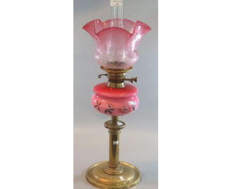 Early 20th Century double oil burner lamp base, having frosted etched foliate cranberry shade, pink opaline glass floral rese