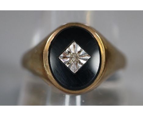 9ct gold onyx and diamond signet ring. 4.4g approx. Size V.(B.P. 21% + VAT) 