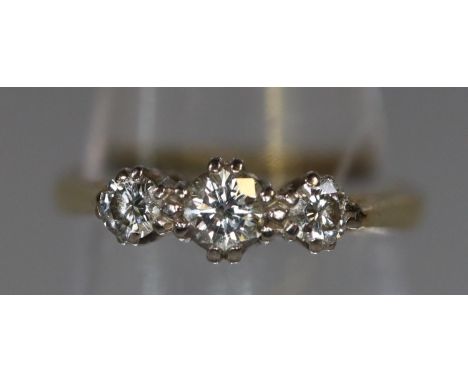 Pretty 18ct gold three stone diamond engagement ring. 2.4g approx, size J. Boxed.(B.P. 21% + VAT) 