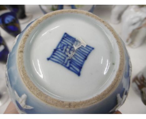 A Chinese blue ground bottle vase with relief enamel, seal mark to base, 14cms approx.