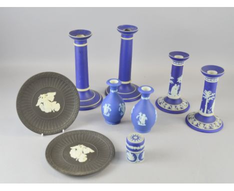 Two pairs of Wedgwood jasper ware candlesticks, two vases, two black plates with angel figures etc. On the plain candlesticks