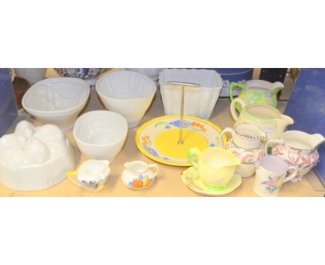 Clarice Cliff jug, a collection of ceramic jelly mould and other items 