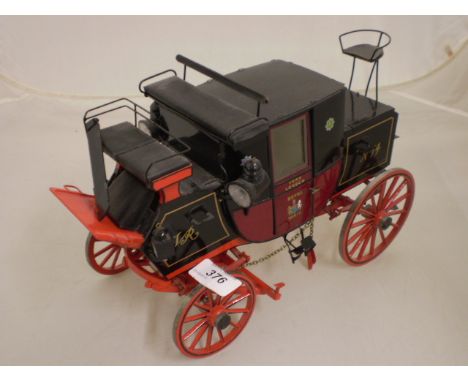 WOODEN SCALE MODEL OF A FAMOUS ROYAL MAIL COACH, WHICH WAS ONCE ATTACKED BY AN ESCAPED LION.    