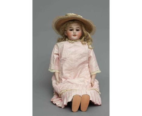 A Simon &amp; Halbig bisque socket head doll, with brown glass sleeping eyes, open mouth, teeth, pierced ears, blond wig, joi