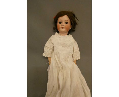 A C. M. Bergmann Waltershausen bisque socket head doll, with blue glass sleeping eyes, open mouth, teeth, wood and compositio