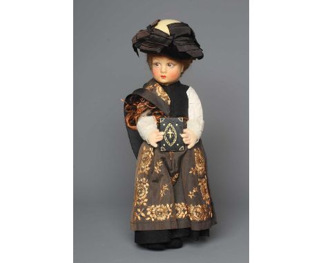 A Lenci doll, of felt construction with blond hair, painted sideways glancing eyes, painted lips, and wearing her "Sunday bes