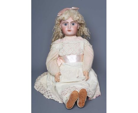 A Jumeau bisque socket head doll, with blue glass fixed eyes, open mouth, teeth, pierced ears, cork pate, blond wig, wood and
