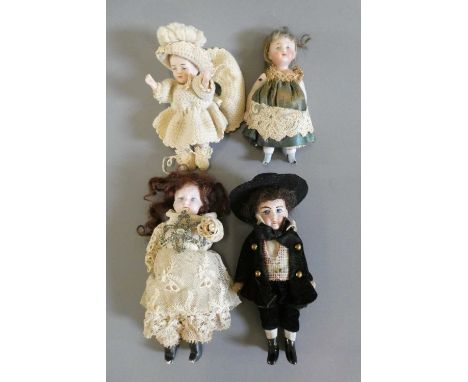 Four all bisque doll's house dolls, all with jointed shoulders and hips, three with straight legs one baby in crochet with be