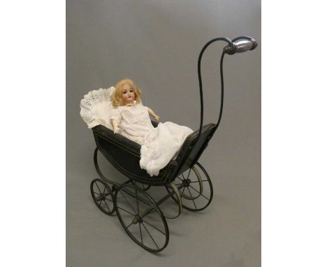 A Simon &amp; Halbig bisque socket head doll, with blue glass sleeping eyes, open mouth, teeth, pierced ears, wood and compos