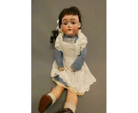 A Max Handwerck bisque socket head doll, with blue glass sleeping eyes, open mouth, teeth, wood and composition jointed body,