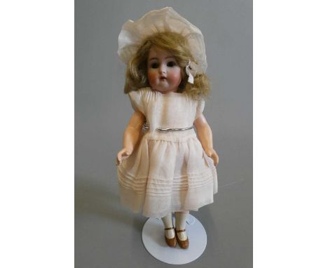 A Kammer &amp; Reinhardt Simon &amp; Halbig bisque socket head doll, with brown glass sleeping eyes, open mouth, teeth, blond