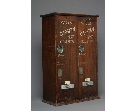 A Wills's Capstan Navy Cut Cigarette dispenser, with twin sides one for a pack at 1/- and the other 6d, wooden case with silv