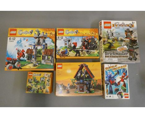 Five boxed Lego sets including Castle 3835/40601/70400/70401/70402 and a Brickmaster book set. Most items in used condition, 